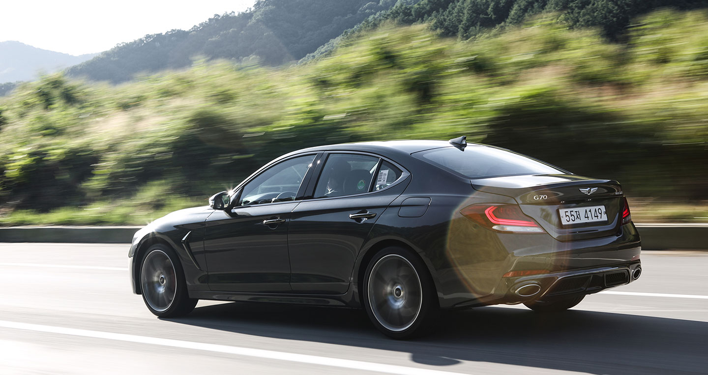 2019-genesis-g70-rear-side-in-motion.jpg