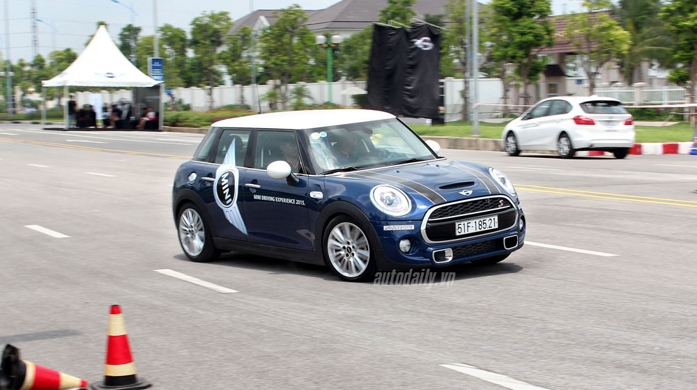 BMW MINI car performing a 180-degree reverse flick in Hanoi